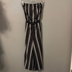 Small White and black striped BE COOL jumpsuit, perfect for summer weather.